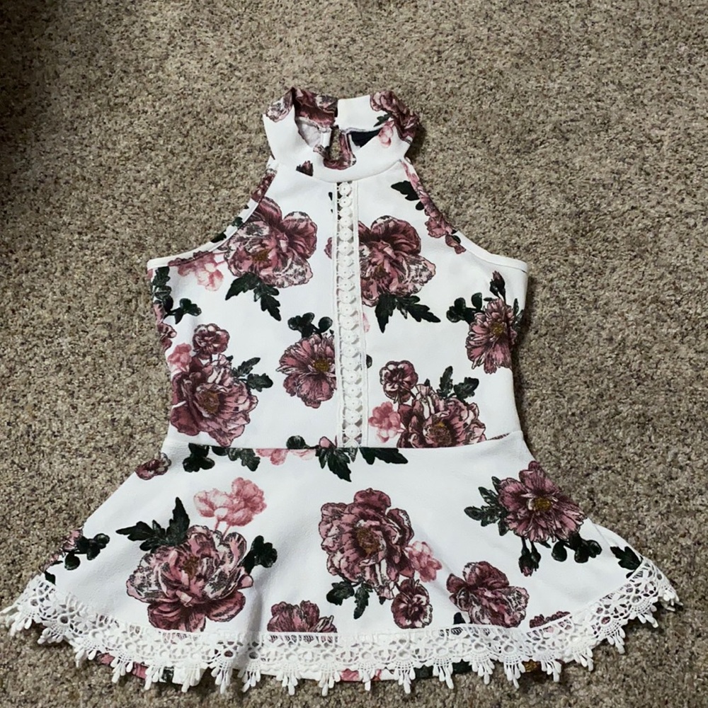 Peplum floral high neck top, snap button closure back, crochet detail, stretchy